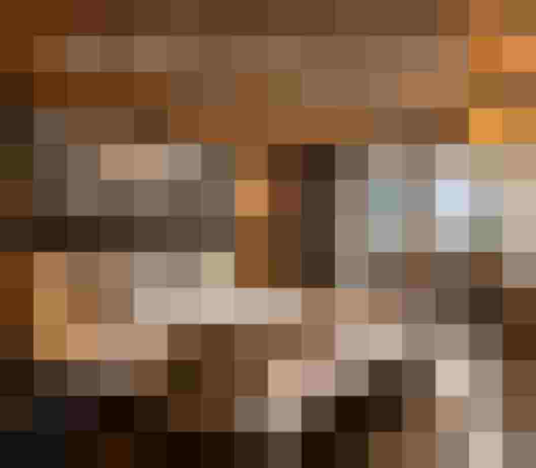 Hotel room with double bed, wooden furnishings, balcony and mountain view at Boutique Hotel Bauer